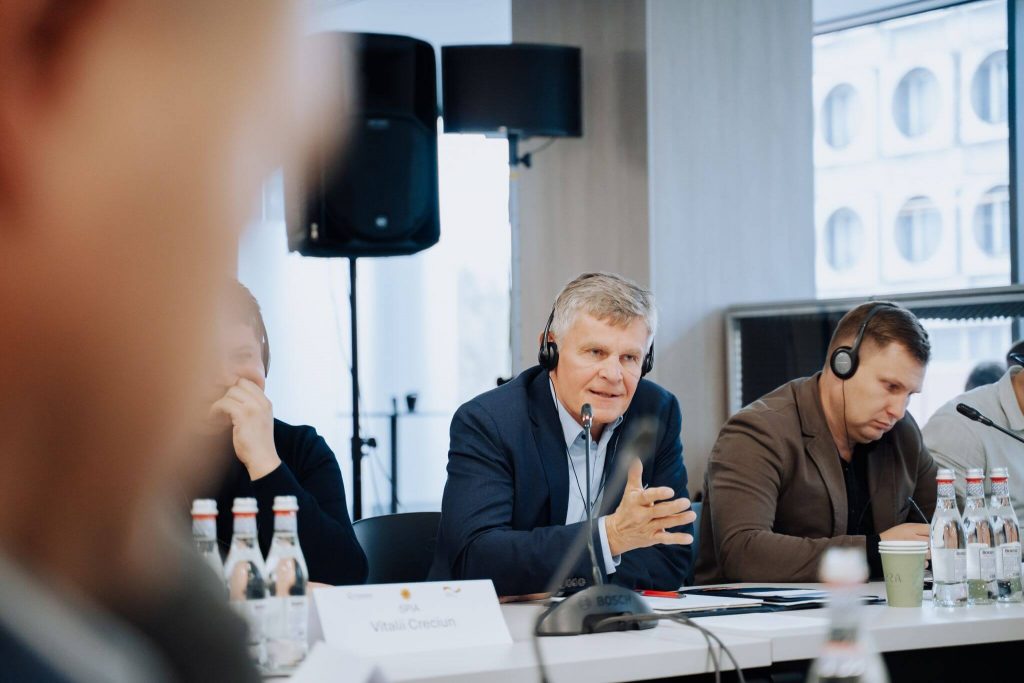 German delegation speaking at conference.