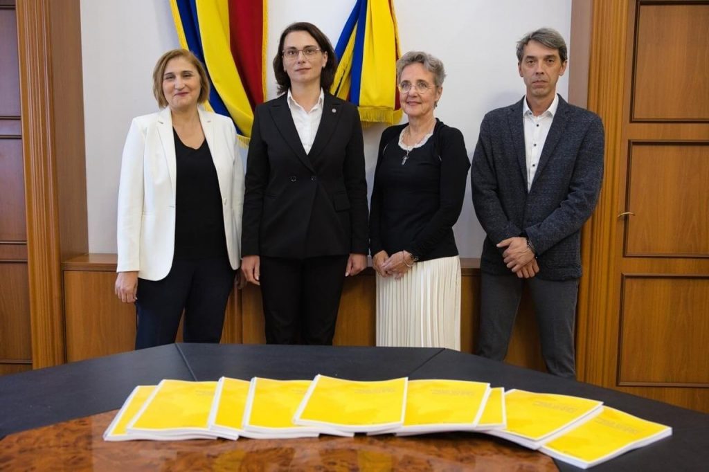 people posing in front of flags,
