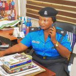 Superintendent Gimbia Audu speaking on the phone at her office