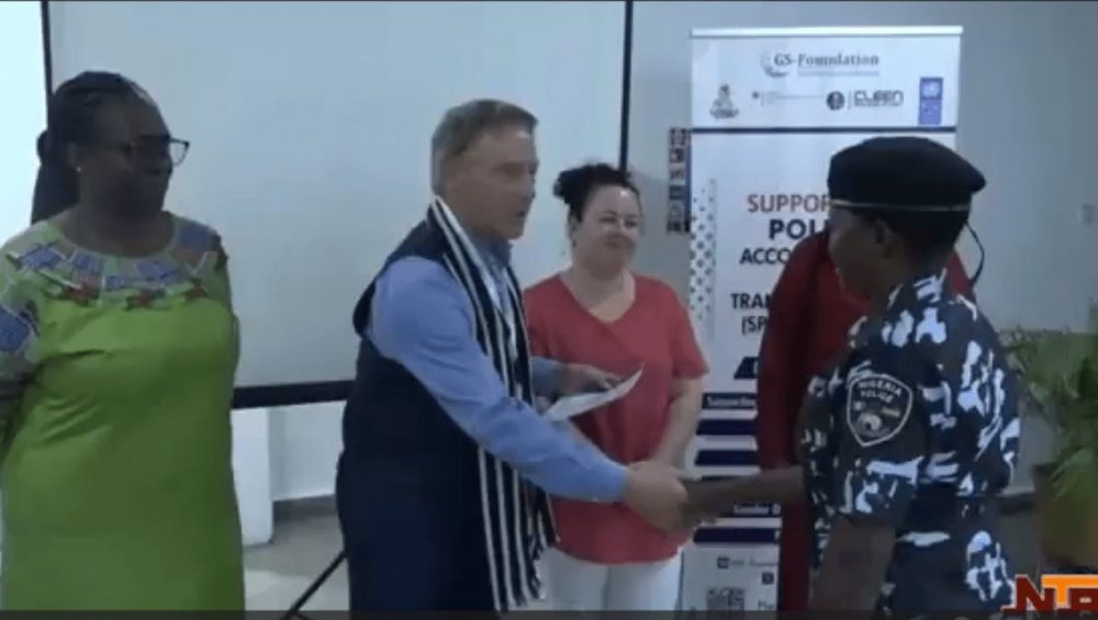 Peter Heepen shakes hands with Gender Desk Officer Training participant