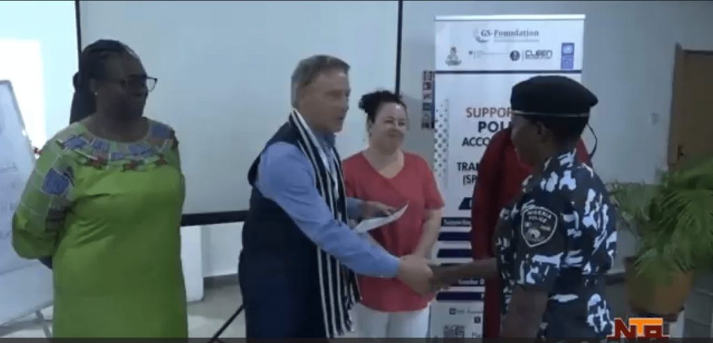Peter Heepen shakes hands with Gender Desk Officer Training participant