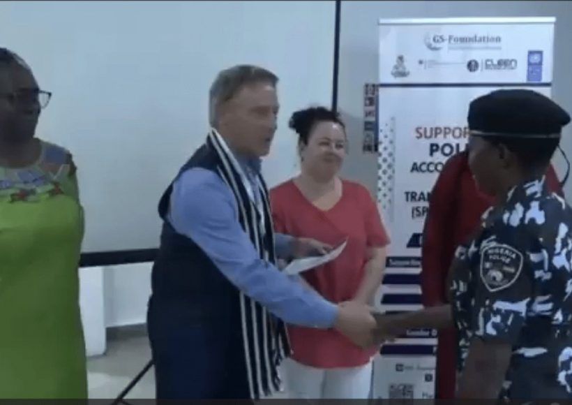 Peter Heepen shakes hands with Gender Desk Officer Training participant