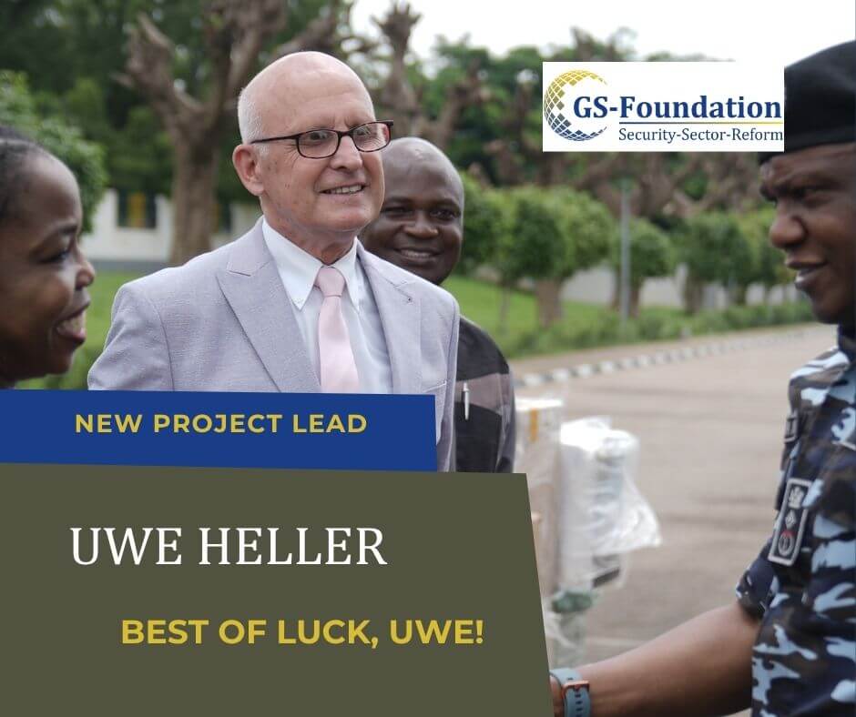 New GS-Foundation project lead Uwe Heller greeting members of the Nigerian Police Force during an outdoor meeting.