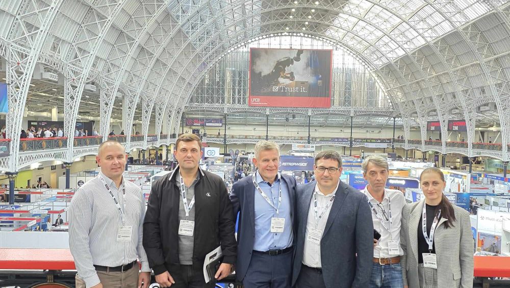 GS-F and Moldovan Police team posing in front of the impressive architecture at the International Security Expo in London.