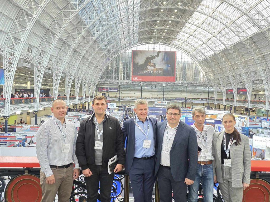 GS-F and Moldovan Police team posing in front of the impressive architecture at the International Security Expo in London.