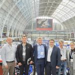 GS-F and Moldovan Police team posing in front of the impressive architecture at the International Security Expo in London.