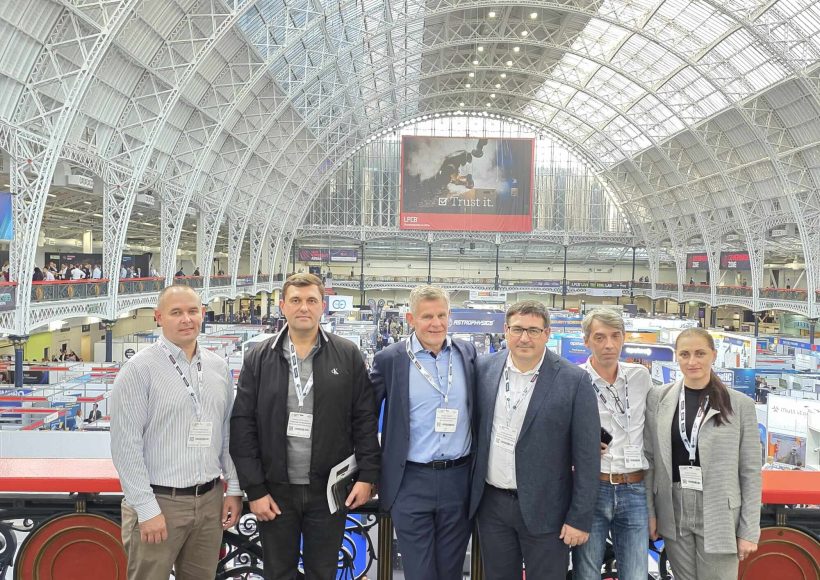GS-F and Moldovan Police team posing in front of the impressive architecture at the International Security Expo in London.