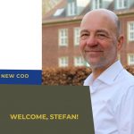 portrait of new COO Stefan Schwarz in front of a brick building