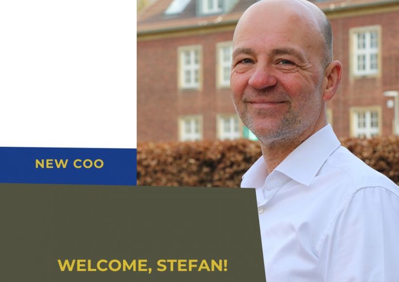 portrait of new COO Stefan Schwarz in front of a brick building
