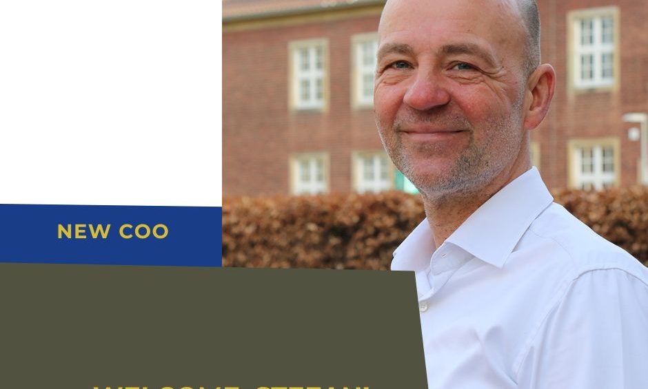 portrait of new COO Stefan Schwarz in front of a brick building